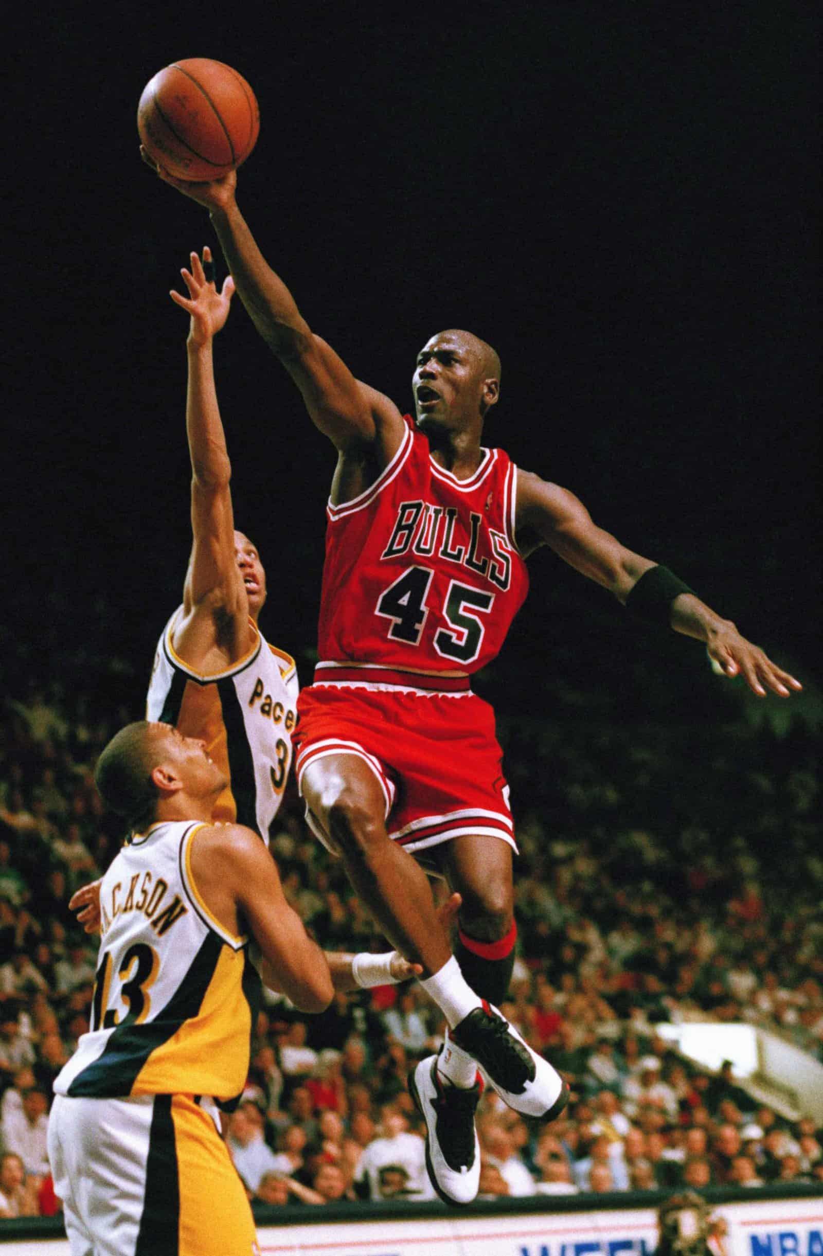 Chicago Bulls guard Michael Jordan (45) flies to the hoop over the Indiana Pacers Reggie Miller and Mark Jackson (13) during the third quarter, March 19, 1995 in Indianapolis. Despite Jordan?s return to basketball, the Pacers beat the Bulls 103-96 in overtime. (AP Photo/Michael Conroy)